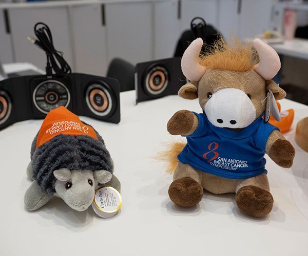 San Antonio, TX - SABCS 2025 San Antonio Breast Cancer Symposium @ SABCS Plush mascots Bully and Armadillo during SABCS Store here today, Tuesday December 9, 2025. during the San Antonio Breast Cancer Symposium being held at the Henry B. Gonzalez Convention Center in San Antonio, TX. The symposium features physicians, researchers, patient advocates and healthcare professionals from over 90 countries with the latest research on breast cancer treatment and prevention. Photo by © MedMeetingImages/Todd Buchanan 2025 Technical Questions: todd@medmeetingimages.com